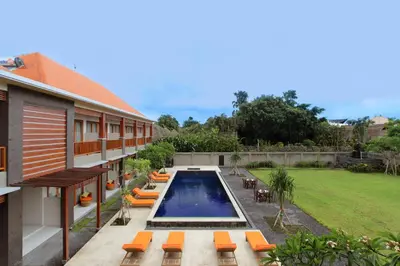 an external view of a house with a swimming pool at Kubu Cempaka Seminyak in Seminyak