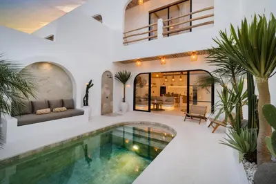 a villa with a swimming pool and a house at Villa Casa Gaia 1 by BaliSuperHost in Umalas
