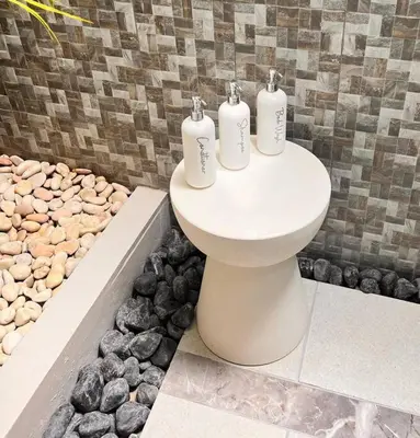 three rolls of toilet paper sitting on top of a sink at Frangipani Villa Seminyak - 2BR Pool Walk to Beach in Seminyak