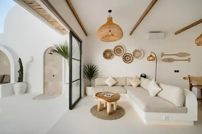 a living room with a couch and a table at Villa Casa Gaia 5 by BaliSuperHost in Kerobokan