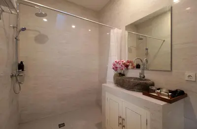a bathroom with a sink and a shower at Bougainvillea Villa Seminyak by Parigata in Seminyak