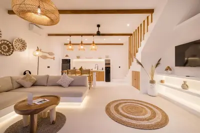 a living room with a couch and a table at Villa Casa Gaia 6 by BaliSuperHost in Kerobokan