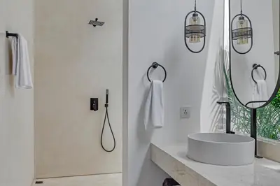 a white bathroom with a sink and a mirror at New Magnificent 3BR 5min to Finns & Berawa Beach Villa Alemar in Canggu