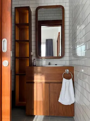 a bathroom with a sink and a mirror at Louise villa in Jimbaran