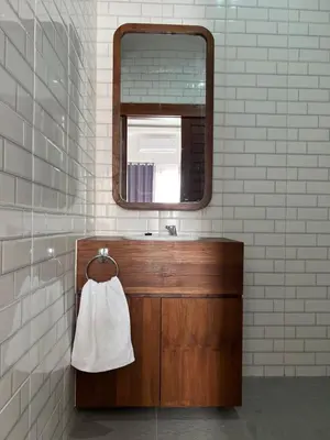 a bathroom with a sink and a mirror at Louise villa in Jimbaran