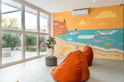 an empty room with an orange bean bag chair at Bali Bustle Sunset Coliving and Coworking Space in Legian