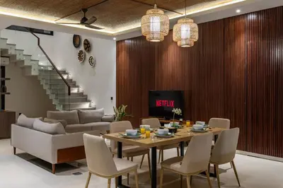 a dining room with a table and chairs at Trendy Modern and Spacious 3Bd Villa in Umalas in Kerobokan