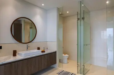 a bathroom with a sink and a mirror at Luxury Chic 3bd Modern Villa in Umalas in Kerobokan
