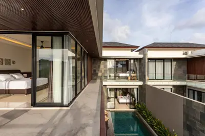 a house with a bedroom and a swimming pool at Luxury Chic 3bd Modern Villa in Umalas in Kerobokan