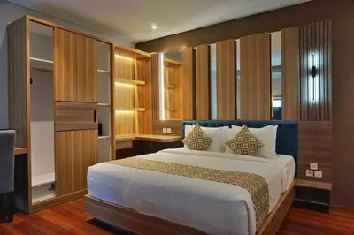 a bedroom with a large bed in a room at The New Moon Umalas in Seminyak