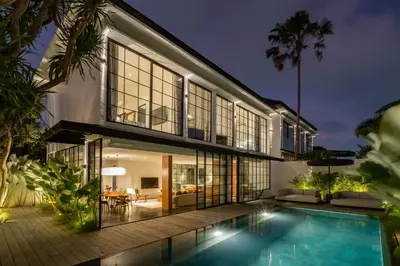 an exterior view of a house with a swimming pool at Casa Siella in Canggu