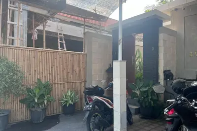 a group of motorcycles parked outside of a house at Ranala Coliving in Seminyak