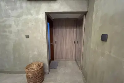 an empty hallway with a door and a basket at Ranala Coliving in Seminyak