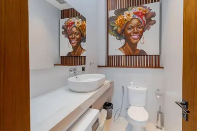 a white bathroom with a sink and a toilet at Casa Estella Stunning 2BR in Umalas Canggu in Kerobokan