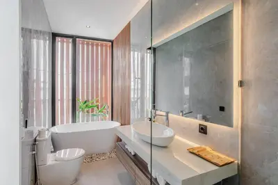 a bathroom with a white tub and a sink at Casa Estella Stunning 2BR in Umalas Canggu in Kerobokan