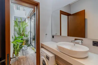 a bathroom with a sink and a mirror at Casa Estella Stunning 2BR in Umalas Canggu in Kerobokan