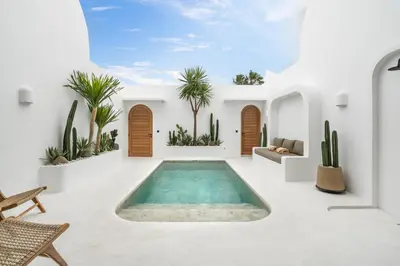 a pool in the middle of a room with cactus at Villa Casa Gaia 3 by BaliSuperHost in Kerobokan