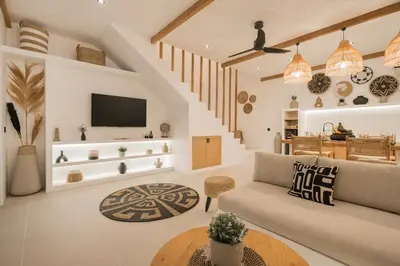 a living room with a couch and a table at Villa Casa Gaia 3 by BaliSuperHost in Kerobokan
