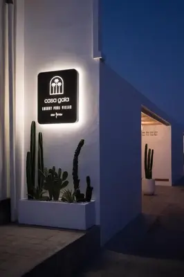 a sign on the side of a building with cactus at Villa Casa Gaia 3 by BaliSuperHost in Kerobokan