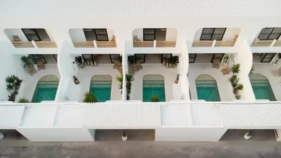 an external view of a building with balconies at Villa Casa Gaia 3 by BaliSuperHost in Kerobokan