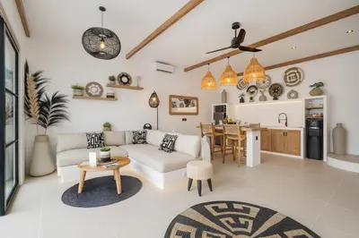 a living room with a couch and a table at Villa Casa Gaia 3 by BaliSuperHost in Kerobokan