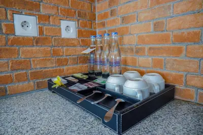a tray with bottles and other items in a brick wall at The Springs Villas Jimbaran in Jimbaran