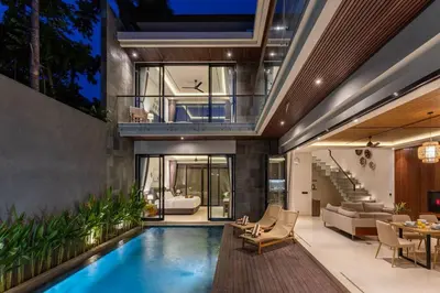 a house with a swimming pool and a living room at Pristine & Modern Gem Luxury 3bd Villa in Umalas in Kerobokan