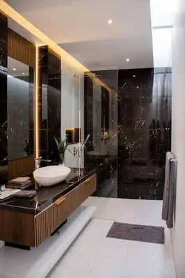 a black bathroom with a sink and a mirror at Luxury Villa Gym Pool and Gazebo in Canggu