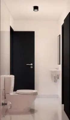 a bathroom with a toilet and a black door at Luxury Villa Gym Pool and Gazebo in Canggu