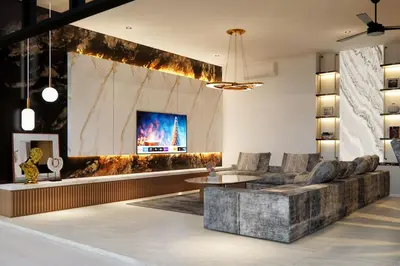 a lobby with a couch and a tv on a wall at Luxury Villa Gym Pool and Gazebo in Canggu