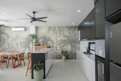 a kitchen and dining room with a ceiling fan at Shanti Villa - 3BR Luxury in Seminyak in Badung