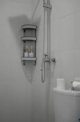 a bathroom with a shower and a sink at Eunoia Villa in Jimbaran