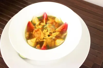a bowl of soup on a white plate at Rofa Kuta Hotel - CHSE Certified in Legian