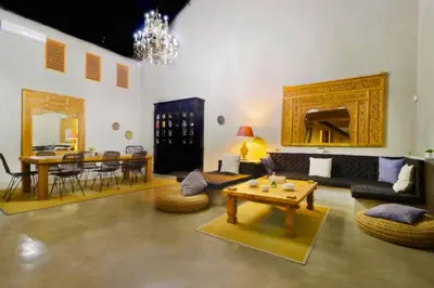 a living room with a couch and a table at Saanvi 2 BR Private Pool Villa in Canggu