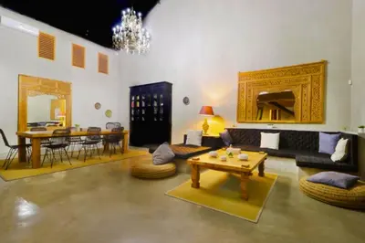 a living room with a couch and a table at Bintarti 3 BR Private Pool Villa in Canggu