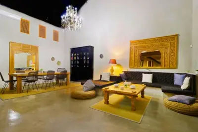 a living room with a couch and a table at Bintarti 3 BR Private Pool Villa in Canggu