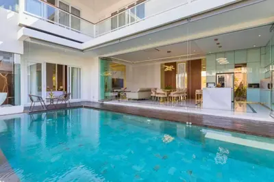 a swimming pool in the middle of a house at Lashana 3 BR Private Pool Villa in Legian