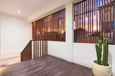 a room with a staircase and a cactus at Lashana 3 BR Private Pool Villa in Legian