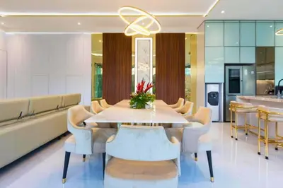 a dining room with a table and chairs at Nayana 4 BR Private Pool Villa in Legian