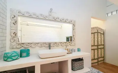 a bathroom with a sink and a mirror at Villa 9C in Seminyak