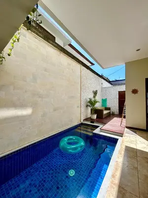 a swimming pool with a frisbee in the middle at MJ Orchid Residence in Seminyak