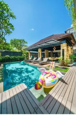 a house with a swimming pool with at Villa J in Nusa Dua
