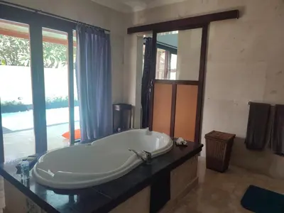 a bathroom with a large tub on a counter at Private villa with swimming pool in Kuta
