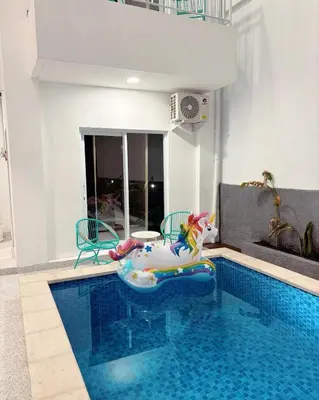 a swimming pool with a toy in the middle of it at Jabu Hasian Bali in Kerobokan