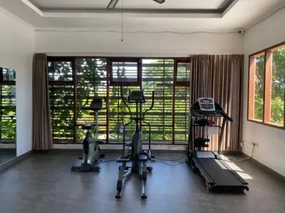 a gym with two exercise bikes and a window at Paradise Haven in Nusa Dua in Nusa Dua