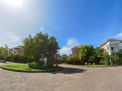 a cobblestone street in a residential neighborhood with houses at Paradise Haven in Nusa Dua in Nusa Dua