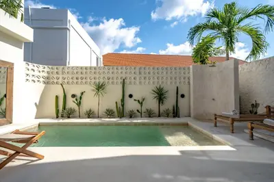 a swimming pool in the backyard of a house at Casanna Umalas in Canggu