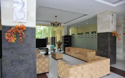 a living room with brown boxes in a room at Bali Mega Hotel in Jimbaran