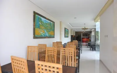 a dining room with a table and chairs at Bali Mega Hotel in Jimbaran