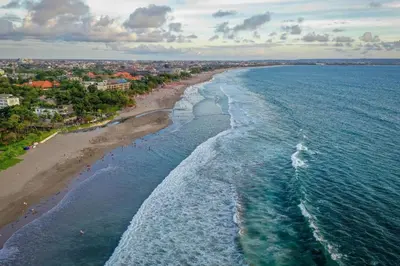 an aerial view of a beach and the ocean at Asoka City Bali Hotel in Legian